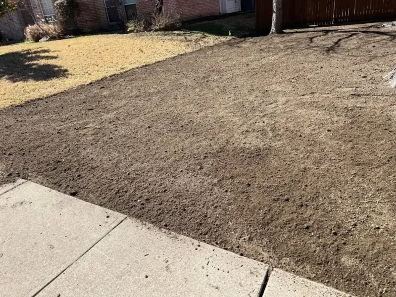 Corner brick home lawn transformation: site preparation, view 4