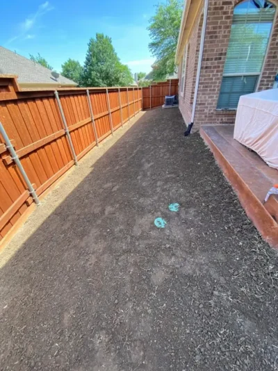 Fenced backyard and side lawn: site preparation, view 2