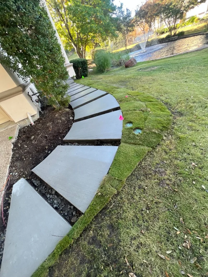 Curved flagstone entry walkway: concrete base and sod, view 6