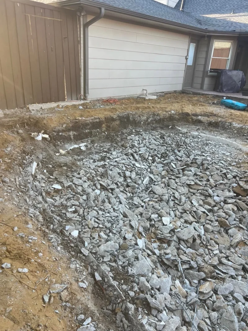 Plano pool removal to lawn: shell demolition, view 9