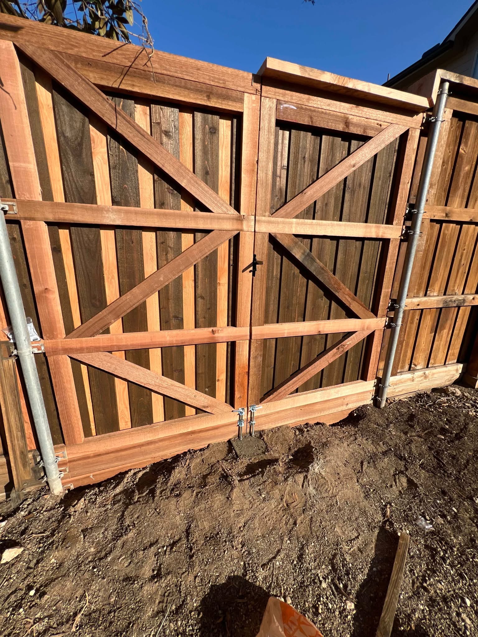 Double gate framing and hardware during installation — Plano Landscaping customer project