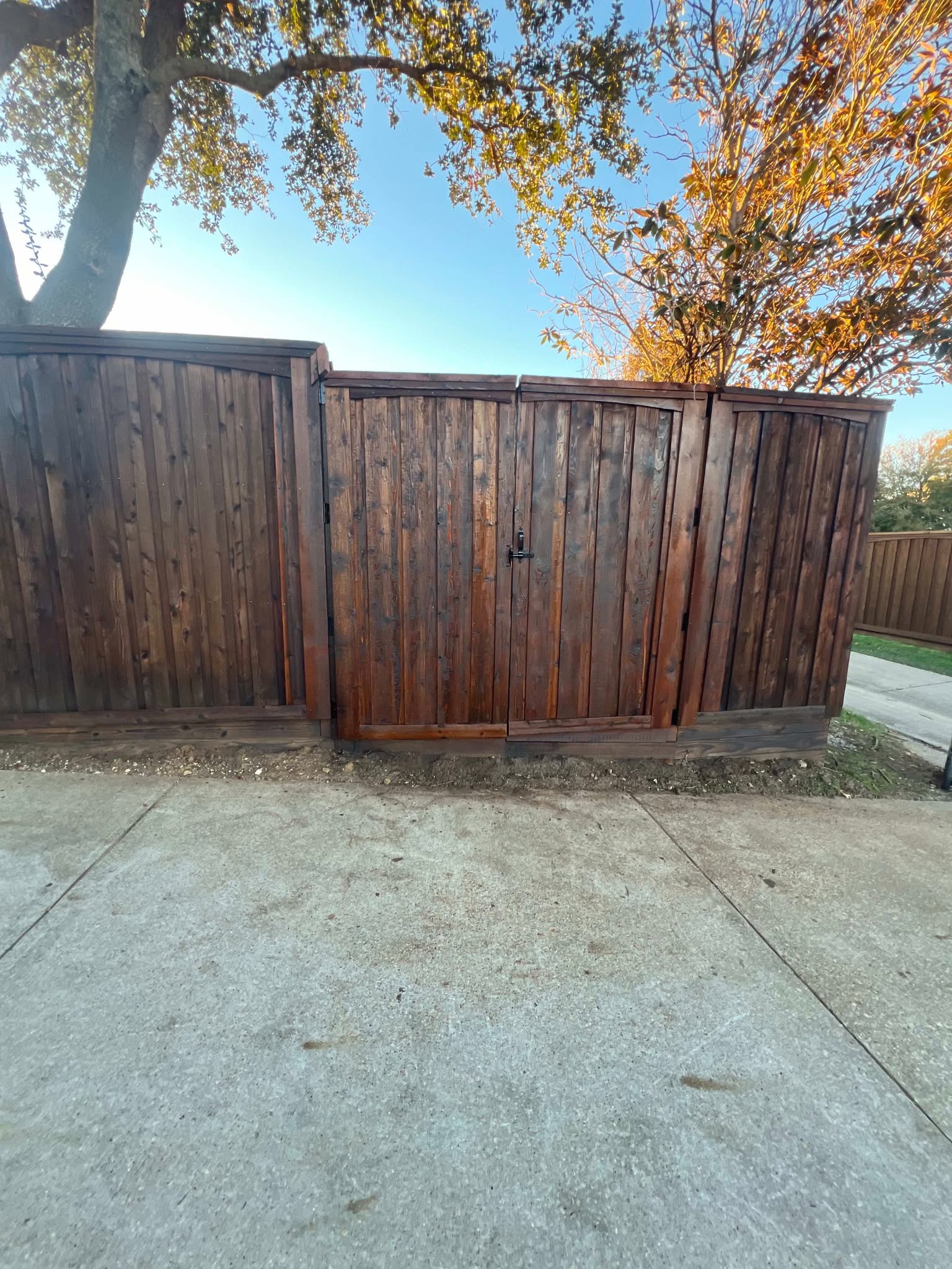 Wood gate viewed from the driveway — Plano Landscaping customer project