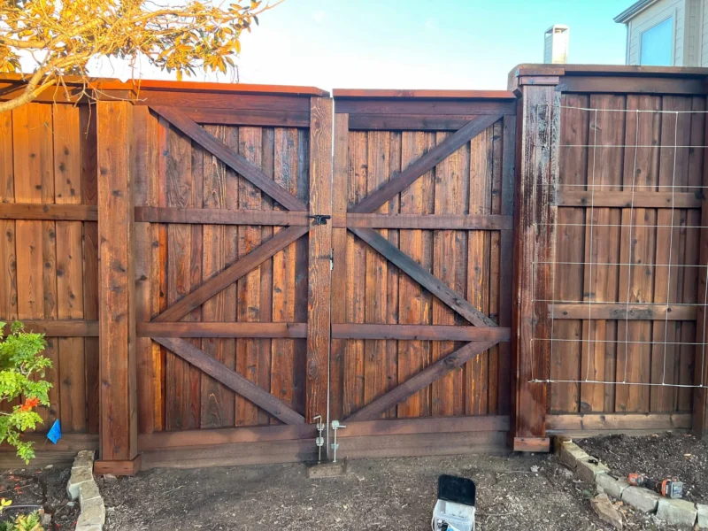 Double wood gate viewed from inside the yard &mdash; Plano Landscaping customer project